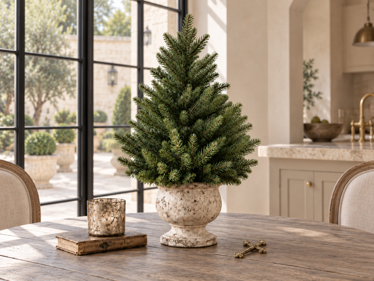 Fraser fir tabletop tree in an ivory urn beside courtyard windows